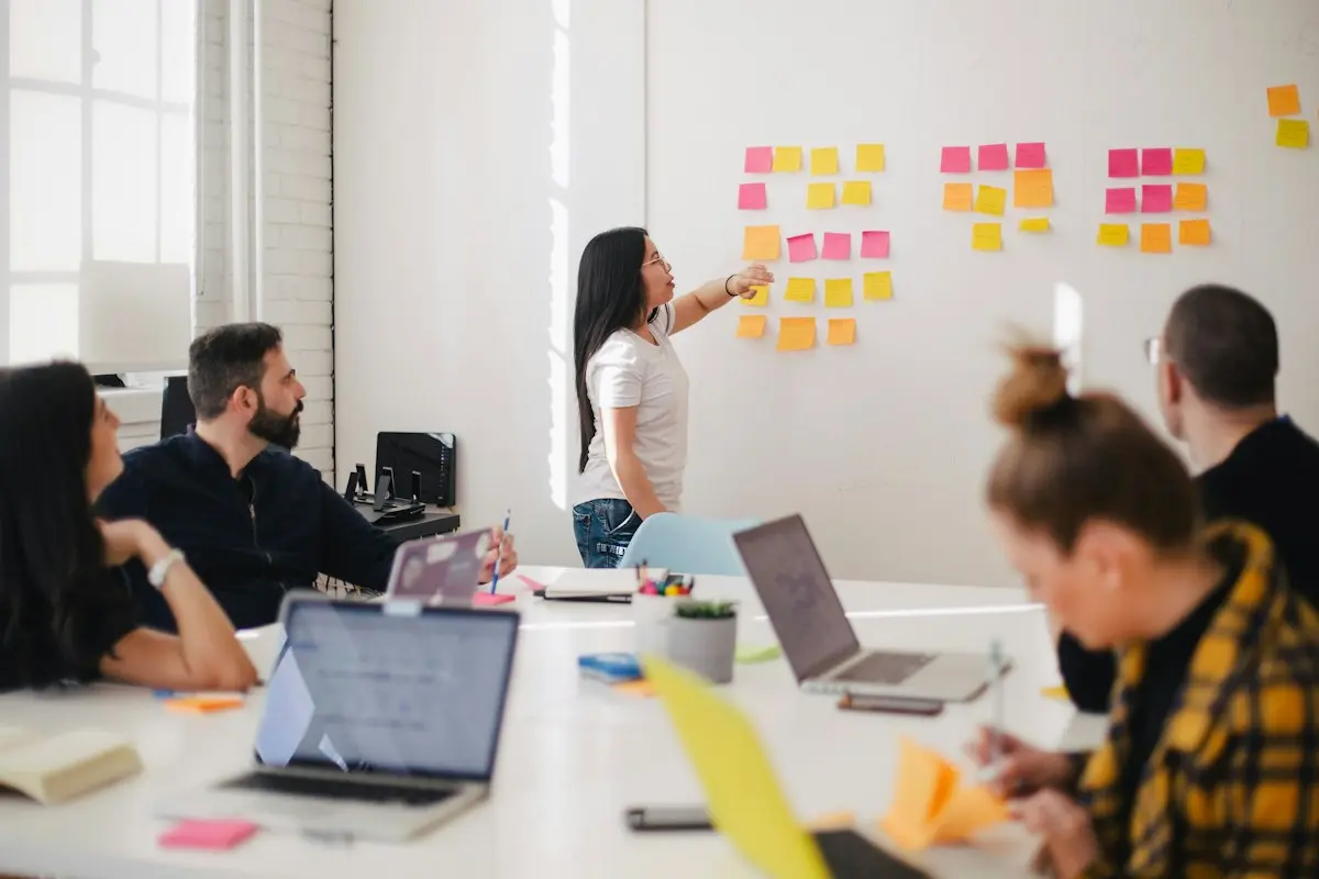 Team planning a project with sticky notes